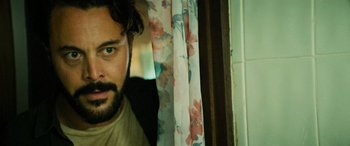 Movie still from “Savage Salvation” (2022), directed by Randall Emmett – A person looking at the camera; Close Up shot, Over the shoulder angle