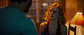 Movie still from “Savage Salvation” (2022), directed by Randall Emmett – A woman is talking to a man in front of a window; Close Up shot, Over the shoulder angle