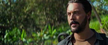 Movie still from “Savage Salvation” (2022), directed by Randall Emmett – A person with a mustache; Close Up shot, Over the shoulder angle