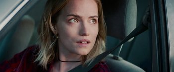 Movie still from “Savage Salvation” (2022), directed by Randall Emmett – A person sitting in a car; Close Up shot, Over the shoulder angle