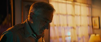 Movie still from “Savage Salvation” (2022), directed by Randall Emmett – An older man looking down at his face; Close Up shot, Low angle