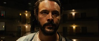 Movie still from “Savage Salvation” (2022), directed by Randall Emmett – A person with a beard; Close Up shot, Low angle