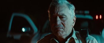 Movie still from “Savage Salvation” (2022), directed by Randall Emmett – An old man with a mustache and a beard; Close Up shot, Low angle