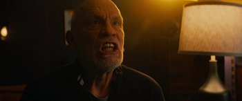 Movie still from “Savage Salvation” (2022), directed by Randall Emmett – An old man with a beard and a black shirt; Close Up shot, Low angle