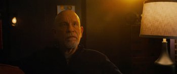 Movie still from “Savage Salvation” (2022), directed by Randall Emmett – An older man with a bald head and a beard; Close Up shot, Low angle