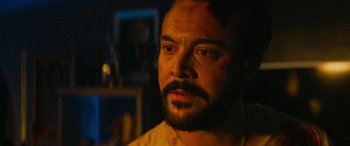 Movie still from “Savage Salvation” (2022), directed by Randall Emmett – A person with a beard; Close Up shot, Over the shoulder angle