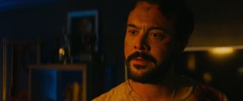 Movie still from “Savage Salvation” (2022), directed by Randall Emmett – A person with a beard; Close Up shot, Over the shoulder angle