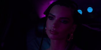 Movie still from “Savage x Fenty Show Vol. 3” (2021), directed by Alex Rudzinski – A beautiful woman with long black hair wearing a purple light; Close Up shot, Over the shoulder angle