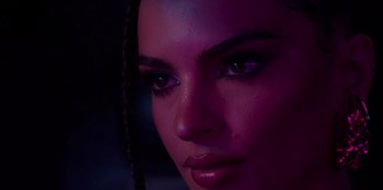 Movie still from “Savage x Fenty Show Vol. 3” (2021), directed by Alex Rudzinski – A woman's face in a purple light; Extreme Close Up shot, Over the shoulder angle