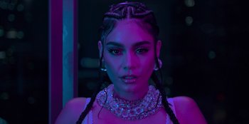 Movie still from “Savage x Fenty Show Vol. 3” (2021), directed by Alex Rudzinski – A woman with braids in a purple room; Close Up shot, Low angle