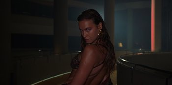 Movie still from “Savage x Fenty Show Vol. 3” (2021), directed by Alex Rudzinski – A beautiful woman with long hair posing for the camera; Medium shot, Low angle