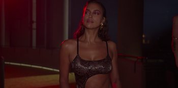 Movie still from “Savage x Fenty Show Vol. 3” (2021), directed by Alex Rudzinski – A beautiful woman in a leopard print bikini top; Medium shot, Low angle