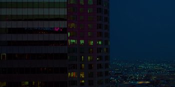 Movie still from “Savage x Fenty Show Vol. 3” (2021), directed by Alex Rudzinski – A view of a city at night from a high rise building; Extreme Wide shot, High angle