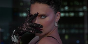 Movie still from “Savage x Fenty Show Vol. 3” (2021), directed by Alex Rudzinski – A beautiful woman with black lace gloves covering her eyes; Extreme Close Up shot, Low angle