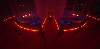 Movie still from “Savage x Fenty Show Vol. 3” (2021), directed by Alex Rudzinski – A group of people standing in a room with neon lights; Extreme Wide shot, High angle