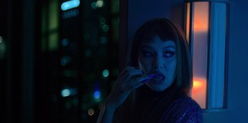 Movie still from “Savage x Fenty Show Vol. 3” (2021), directed by Alex Rudzinski – A woman is brushing her teeth in the dark; Close Up shot, Low angle