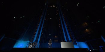 Movie still from “Savage x Fenty Show Vol. 3” (2021), directed by Alex Rudzinski – A person standing on a stage in front of an audience; Extreme Wide shot, High angle