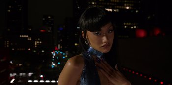Movie still from “Savage x Fenty Show Vol. 3” (2021), directed by Alex Rudzinski – A woman in a blue dress is posing for a picture; Close Up shot, Low angle