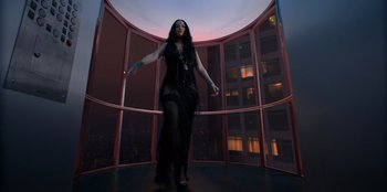 Movie still from “Savage x Fenty Show Vol. 3” (2021), directed by Alex Rudzinski – A woman standing in front of a window in a room; Wide shot, Overhead angle