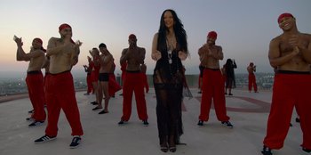 Movie still from “Savage x Fenty Show Vol. 3” (2021), directed by Alex Rudzinski – A group of men and a woman dancing on a roof; Wide shot, Overhead angle