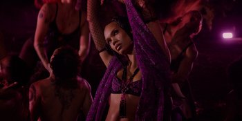 Movie still from “Savage x Fenty Show Vol. 4” (2022), directed by Alex Rudzinski – A woman in a purple bra and a purple veil; Medium shot, Low angle