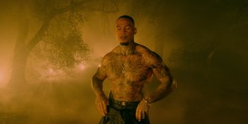 Movie still from “Savage x Fenty Show Vol. 4” (2022), directed by Alex Rudzinski – A man standing in the dark with his hands on his hips; Medium shot, Low angle