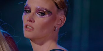 Movie still from “Savage x Fenty Show Vol. 4” (2022), directed by Alex Rudzinski – A person with makeup on; Close Up shot, Low angle