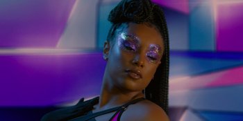 Movie still from “Savage x Fenty Show Vol. 4” (2022), directed by Alex Rudzinski – A person with makeup on; Close Up shot, Low angle