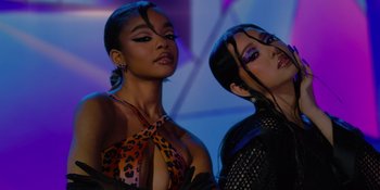 Movie still from “Savage x Fenty Show Vol. 4” (2022), directed by Alex Rudzinski – A couple of women standing next to each other on a stage; Close Up shot, Low angle