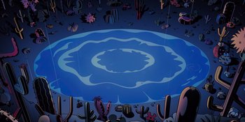 Movie still from “Savage x Fenty Show Vol. 4” (2022), directed by Alex Rudzinski – An image of a desert scene with cactus and water; Extreme Wide shot, High angle