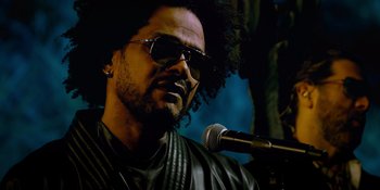 Movie still from “Savage x Fenty Show Vol. 4” (2022), directed by Alex Rudzinski – A person with a microphone; Close Up shot, Low angle