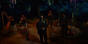 Movie still from “Savage x Fenty Show Vol. 4” (2022), directed by Alex Rudzinski – A group of people standing in a dark room; Wide shot, High angle