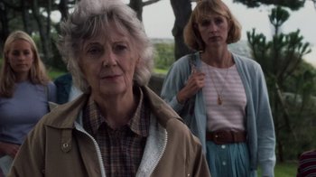 Movie still from “Saving Private Ryan” (1998), directed by Steven Spielberg – Two older women standing next to each other in a park; Close Up shot, Low angle