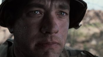 Movie still from “Saving Private Ryan” (1998), directed by Steven Spielberg – A person wearing a helmet; Close Up shot, Low angle