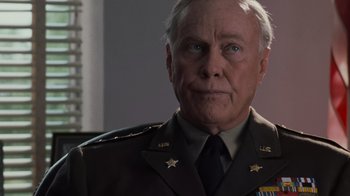 Movie still from “Saving Private Ryan” (1998), directed by Steven Spielberg – An older man in a military uniform looking at the camera; Close Up shot, Low angle