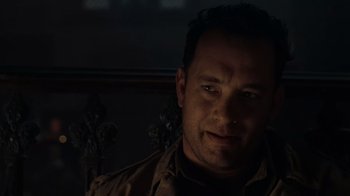 Movie still from “Saving Private Ryan” (1998), directed by Steven Spielberg – A person wearing a brown jacket; Close Up shot, Over the shoulder angle