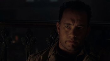 Movie still from “Saving Private Ryan” (1998), directed by Steven Spielberg – A man in a brown jacket is looking at the camera; Close Up shot, Over the shoulder angle