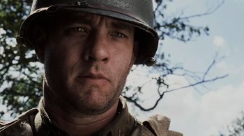Movie still from “Saving Private Ryan” (1998), directed by Steven Spielberg – A person wearing a helmet; Close Up shot, Low angle
