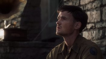 Movie still from “Saving Private Ryan” (1998), directed by Steven Spielberg – A person wearing a military uniform; Close Up shot, Low angle