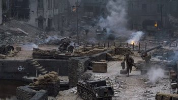 Movie still from “Saving Private Ryan” (1998), directed by Steven Spielberg – An image of an action movie scene in a city setting; Extreme Wide shot, High angle