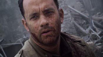 Movie still from “Saving Private Ryan” (1998), directed by Steven Spielberg – A man with blood all over his face and chest; Close Up shot, Low angle