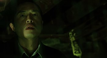 Movie still from “Saw” (2004), directed by James Wan – A person in a dark room; Close Up shot, Low angle