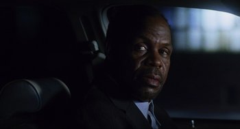 Movie still from “Saw” (2004), directed by James Wan – A man sitting in a car in the dark; Close Up shot, Over the shoulder angle