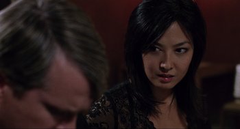 Movie still from “Saw” (2004), directed by James Wan – A woman sitting next to a man in a room; Close Up shot, Over the shoulder angle