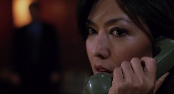 Movie still from “Saw” (2004), directed by James Wan – A person talking on a phone; Close Up shot, High angle
