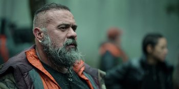 Movie still from “Sayen” (2023), directed by Alexander Witt – A man with a beard and a gray beard; Close Up shot, Low angle