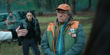 Movie still from “Sayen” (2023), directed by Alexander Witt – An older man and a young woman in the woods; Medium shot, Over the shoulder angle