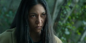 Movie still from “Sayen” (2023), directed by Alexander Witt – A person with long black hair; Close Up shot, Low angle