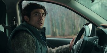 Movie still from “Sayen” (2023), directed by Alexander Witt – A man sitting in the drivers seat of a car; Close Up shot, Over the shoulder angle