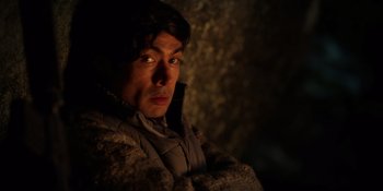 Movie still from “Sayen” (2023), directed by Alexander Witt – A man in a hooded jacket is looking at the camera; Close Up shot, High angle